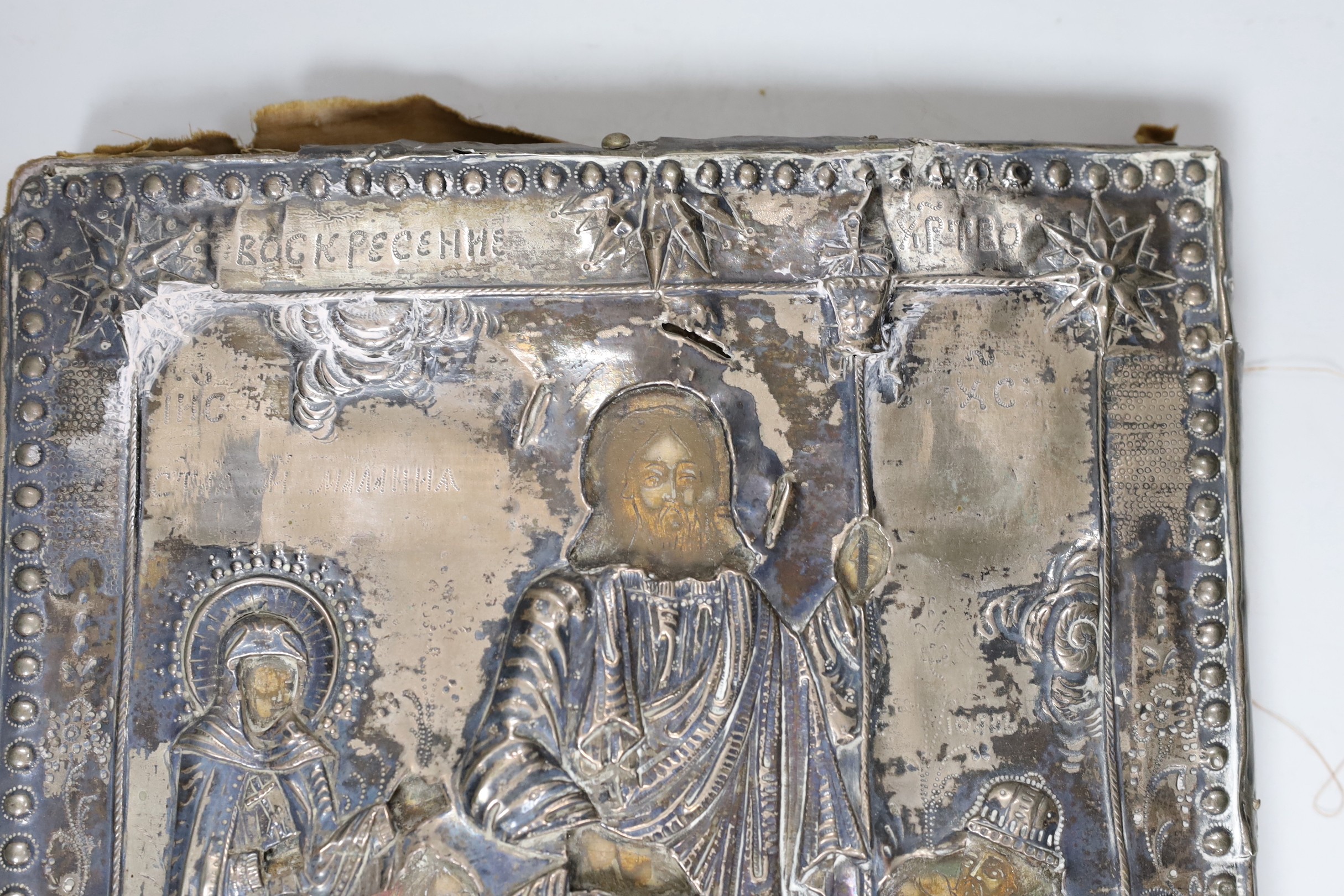 A 19th century Eastern European icon with white metal oklad 30x26cm